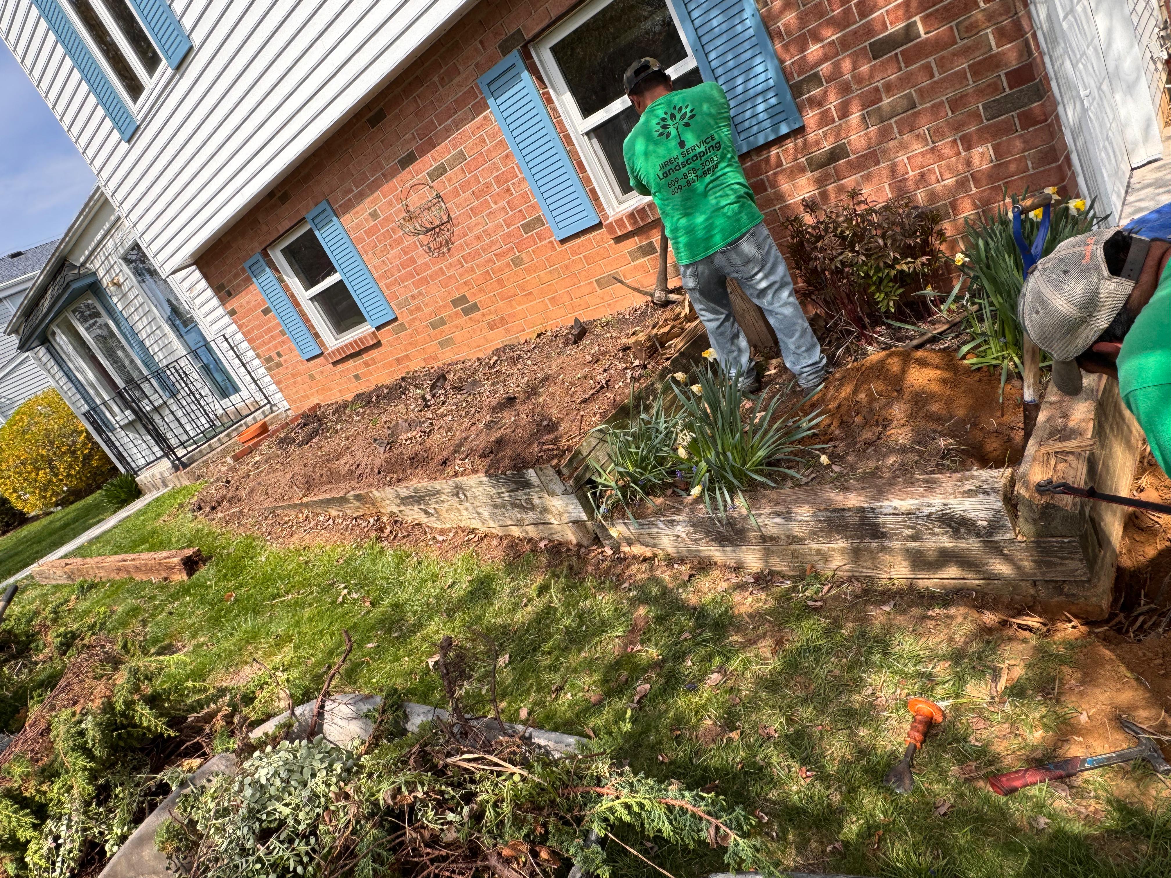JIREH SERVICE crew preparing a residential landscape bed
