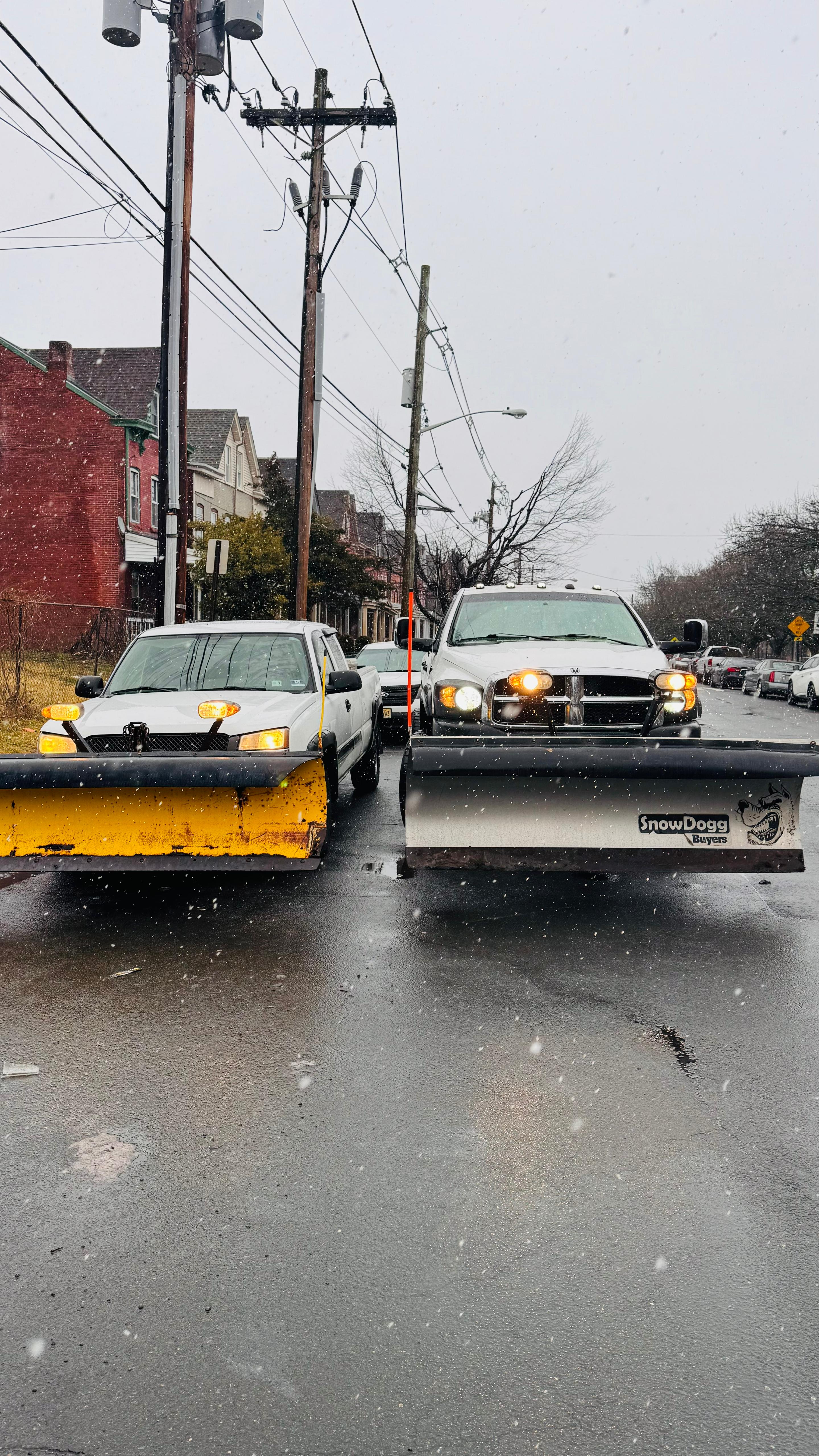 Snow removal equipment at work on a property